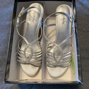 Medium height silver heals. Embellished with clear rhinestones.